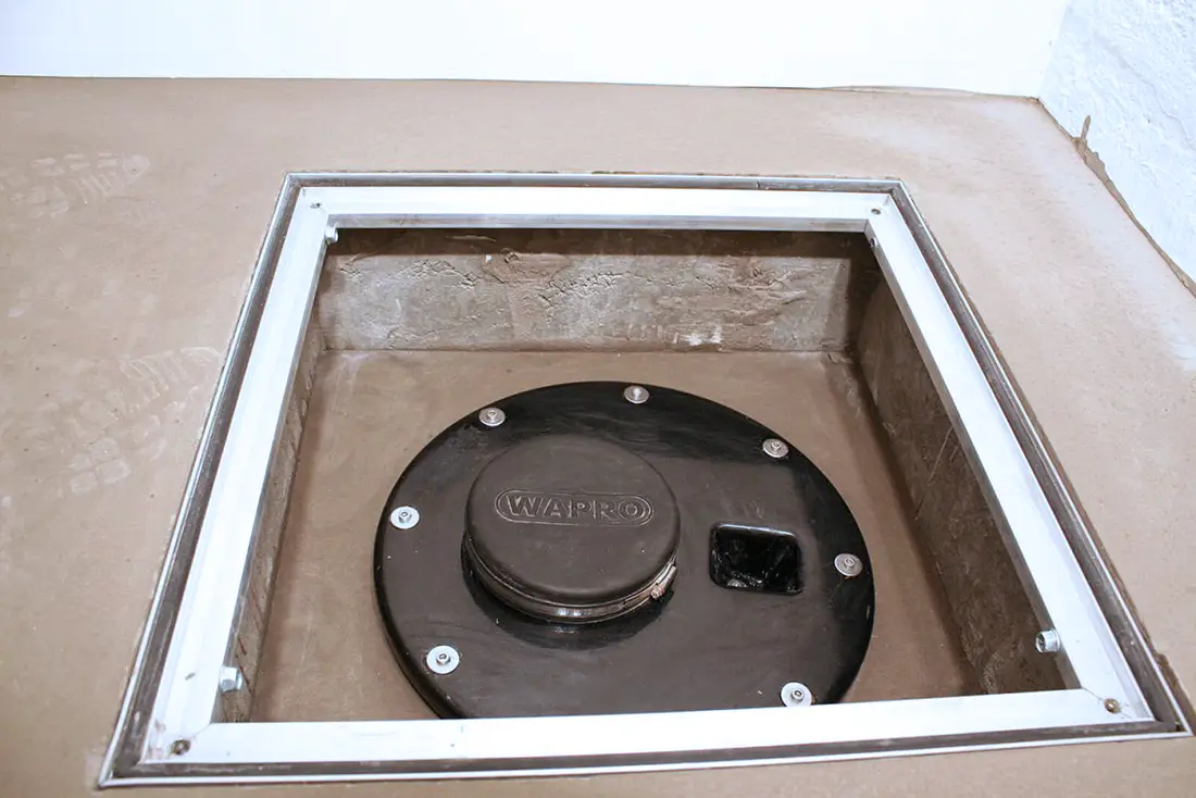 waback-rsd-check-valve-inspection-well-basement-renovation-installation-us WaBack RSD check valve placed in basement floor for flood protection